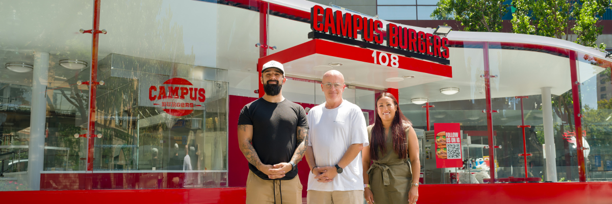 Owner in front of restaurants